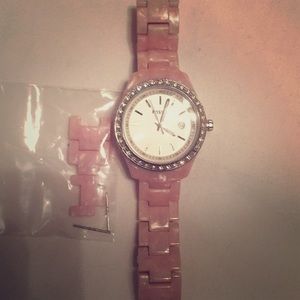 Pink Fossil watch with original links.